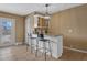 Stylish bar area with granite countertop, white cabinets, and seating for two at 5519 W Campbell Ave, Phoenix, AZ 85031