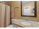 Granite countertop sink bathroom with a shower and neutral tones at 5519 W Campbell Ave, Phoenix, AZ 85031