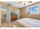 Neutral toned bedroom featuring an adjacent dining space and large window with blinds at 5519 W Campbell Ave, Phoenix, AZ 85031