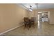 Bright dining area featuring tile flooring and modern lighting fixtures at 5519 W Campbell Ave, Phoenix, AZ 85031