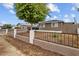Cozy home featuring a secure front yard with a classic decorative fence at 5519 W Campbell Ave, Phoenix, AZ 85031