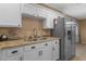Modern kitchen with stainless steel appliances and a double sink at 5519 W Campbell Ave, Phoenix, AZ 85031