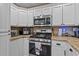 Functional kitchen space featuring modern appliances and sleek countertops at 5519 W Campbell Ave, Phoenix, AZ 85031