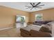 Comfortable living room features a large sectional sofa, TV, and neutral colors at 5519 W Campbell Ave, Phoenix, AZ 85031