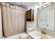 Bathroom featuring a shower with a curtain, a marble sink, and a unique cabinet at 5809 E Thomas Rd, Scottsdale, AZ 85251