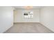 Bright bedroom showcasing neutral carpet, white walls and a modern light fixture at 5809 E Thomas Rd, Scottsdale, AZ 85251