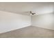 Bedroom with neutral carpet and a fan, providing a cozy and comfortable atmosphere at 5809 E Thomas Rd, Scottsdale, AZ 85251
