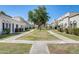 Well-maintained community featuring lush green spaces, walking paths, and charming building exteriors at 5809 E Thomas Rd, Scottsdale, AZ 85251