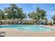 Relaxing community pool with comfortable seating and a beautifully landscaped area at 5809 E Thomas Rd, Scottsdale, AZ 85251