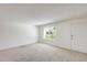 Comfortable living room with a front door and a window providing natural light at 5809 E Thomas Rd, Scottsdale, AZ 85251