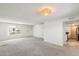 Comfortable living room with a front door and a view to a kitchen area at 5809 E Thomas Rd, Scottsdale, AZ 85251