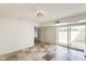 Well-lit living area boasts stone floors, access to a covered patio, and a stylish wicker light at 5809 E Thomas Rd, Scottsdale, AZ 85251