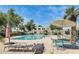Community pool with lounge chairs and tables, perfect for relaxing and enjoying sunny days at 5809 E Thomas Rd, Scottsdale, AZ 85251