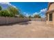 Spacious backyard with block wall, offering privacy and potential for customization and landscaping at 6432 S 23Rd Ave, Phoenix, AZ 85041