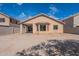 Backyard featuring dirt landscaping, block fence, and covered patio at 6432 S 23Rd Ave, Phoenix, AZ 85041