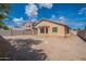 Backyard featuring dirt landscaping, block fence, and covered patio at 6432 S 23Rd Ave, Phoenix, AZ 85041