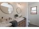 Bathroom featuring dual sinks, stylish fixtures, and plenty of counter space at 6432 S 23Rd Ave, Phoenix, AZ 85041