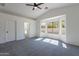Bright bedroom features large bay windows and a ceiling fan for added comfort at 6432 S 23Rd Ave, Phoenix, AZ 85041