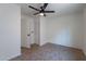 Bedroom featuring tile flooring, closet and entrance with neutral walls at 6432 S 23Rd Ave, Phoenix, AZ 85041