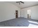 View of the bedroom with entrances to the bathroom and the walk-in closet at 6432 S 23Rd Ave, Phoenix, AZ 85041