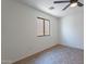 Bedroom featuring tile flooring, ceiling fan, and window for natural lighting at 6432 S 23Rd Ave, Phoenix, AZ 85041