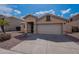 Single story home with a two car garage and desert landscaping at 6432 S 23Rd Ave, Phoenix, AZ 85041