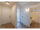 Hallway with open view of a bathroom and bedroom at 6432 S 23Rd Ave, Phoenix, AZ 85041