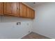 Laundry room with cabinets and washer/dryer hookups at 6432 S 23Rd Ave, Phoenix, AZ 85041
