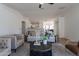 Open concept living area showcasing modern furniture and natural light at 6432 S 23Rd Ave, Phoenix, AZ 85041