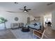 Bright living room featuring modern furniture and a ceiling fan at 6432 S 23Rd Ave, Phoenix, AZ 85041