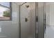 Shower with glass door and modern fixtures, providing a clean and functional design at 6432 S 23Rd Ave, Phoenix, AZ 85041