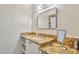 Bathroom vanity featuring granite countertop, undermount sink, ample storage and large mirror at 6626 N Majorca E Way, Phoenix, AZ 85016