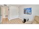 Bedroom featuring built in cabinets, wood floors and large picture window at 6626 N Majorca E Way, Phoenix, AZ 85016