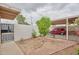 Cozy gated and landscaped backyard with a red car in the covered carport at 6626 N Majorca E Way, Phoenix, AZ 85016