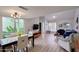 Open living area with dining table, vaulted ceilings, and abundant natural light at 6626 N Majorca E Way, Phoenix, AZ 85016