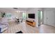 Spacious living area with wood floors, modern furniture, and sliding glass doors at 6626 N Majorca E Way, Phoenix, AZ 85016