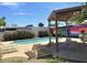 Community pool and lounge area with colorful murals and desert landscaping at 6626 N Majorca E Way, Phoenix, AZ 85016