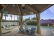 Community pool area with lounge seating under a shade structure at 6626 N Majorca E Way, Phoenix, AZ 85016