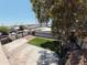 Overhead view of a large backyard with artificial turf, concrete patios, and mature trees offering ample shade at 6823 W Garfield St, Phoenix, AZ 85043