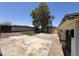 Backyard featuring a concrete patio, artificial grass, and storage shed at 6823 W Garfield St, Phoenix, AZ 85043