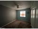 Bedroom with carpeted floors, ceiling fan, and window at 6823 W Garfield St, Phoenix, AZ 85043