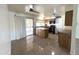 Kitchen with stainless steel appliances, wood cabinets, and a sliding glass door with access to the outside at 6823 W Garfield St, Phoenix, AZ 85043