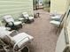 Relaxing backyard setup with comfortable lounge chairs, a small table, and gravel ground cover at 7750 E Broadway Rd # 123, Mesa, AZ 85208