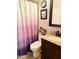 Cozy bathroom featuring a vanity, toilet, and a shower with a stylish shower curtain at 7750 E Broadway Rd # 123, Mesa, AZ 85208