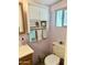 Efficient bathroom layout with a toilet, vanity with storage, and towel rack for convenience at 7750 E Broadway Rd # 123, Mesa, AZ 85208