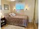 Bedroom with a comfortable bed, side table and a neutral color scheme at 7750 E Broadway Rd # 123, Mesa, AZ 85208