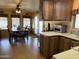 This shot shows the dining room from the kitchen, with a table and chairs visible near the entry at 7750 E Broadway Rd # 123, Mesa, AZ 85208