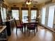 Cozy dining area with wood floors, bright windows, and space for a table of six at 7750 E Broadway Rd # 123, Mesa, AZ 85208