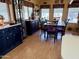 A dining room is visible with a wood table, six chairs with purple cushions, and a built-in hutch at 7750 E Broadway Rd # 123, Mesa, AZ 85208