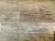 A close-up of the wood-look flooring showcasing its wood grain and plank design at 7750 E Broadway Rd # 123, Mesa, AZ 85208